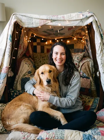 Fairy-light den sample: a woman with long brown hair and her golden retriever